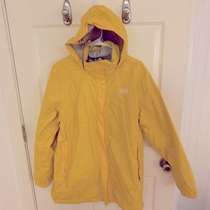 Yellow and white polka dot North Face rain jacket